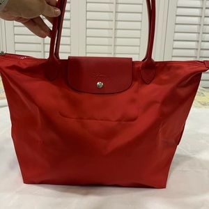 Large Longchamp LePliage NEO- discontinued model in the color RED